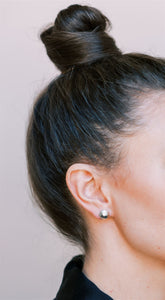 K. Signature studs